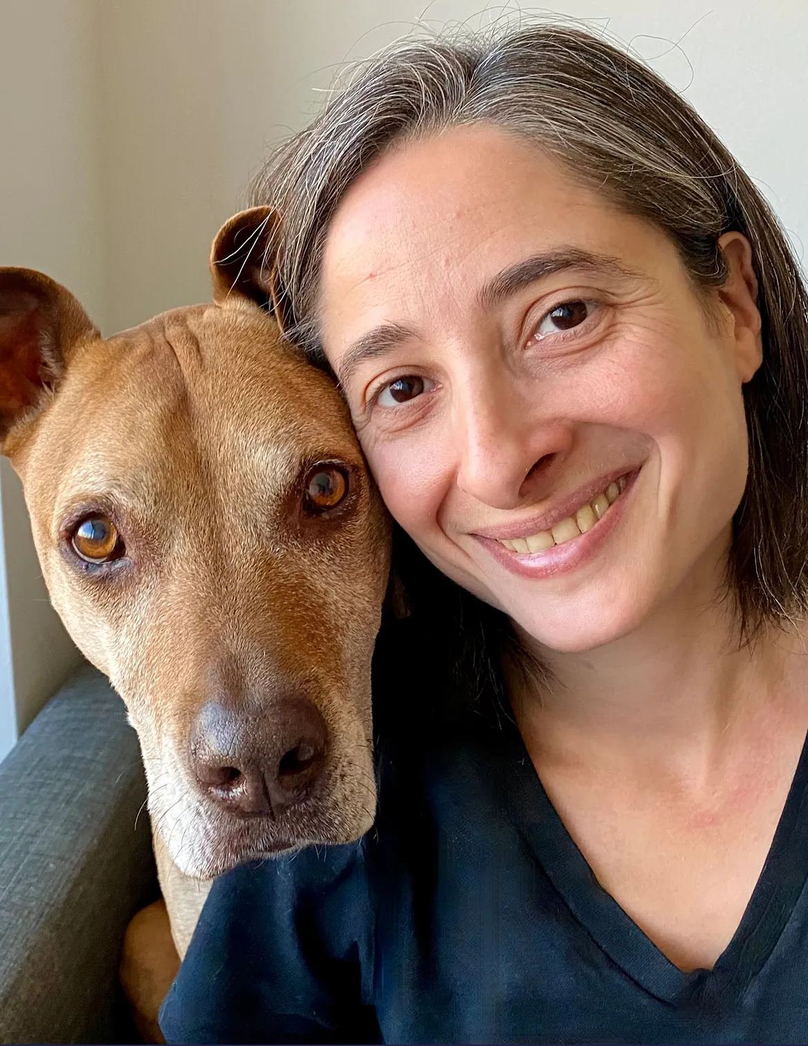 Dr. Gira Babha is pictured with her dog. 