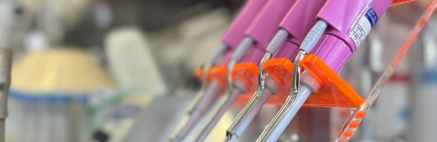 pink pipettes in lab