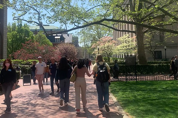 students walk on the east side of Columbia's campus